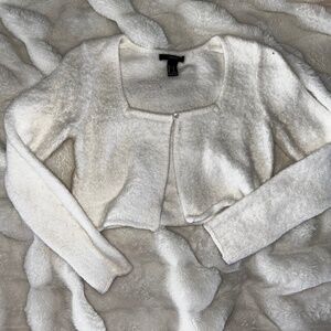 white fuzzy sweater